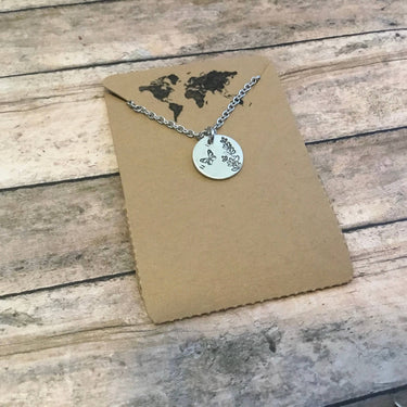 Lavender Butterfly necklace featuring small circle charm with delicate design