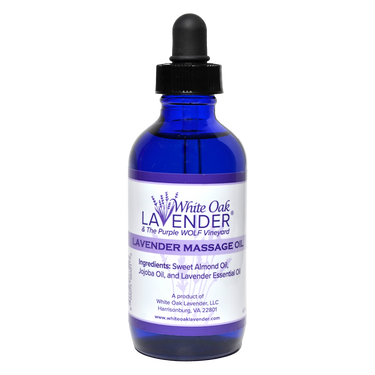 Front view of 4 oz Massage Oil bottle showing full list of ingredients on the label