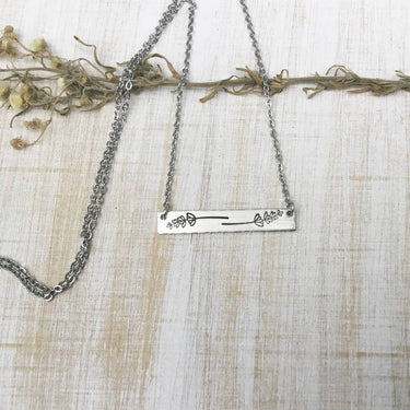 Lavender sprig bar necklace featuring delicate lavender-inspired design