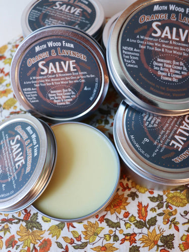 Orange & Lavender Salve open jar showing smooth cream texture inside with cap removed