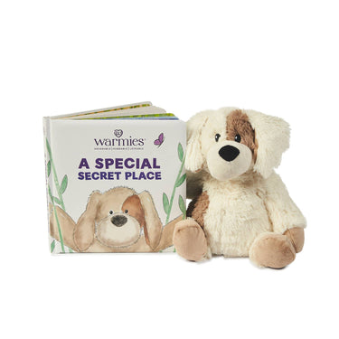 Children's board book "A Secret Special Place" displayed alongside Golden Dog Warmies Junior plush for a gift set or playtime