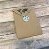 Lavender Butterfly necklace featuring small circle charm with delicate design