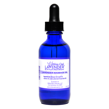 Front view of 2 oz Massage Oil bottle showing full list of ingredients on the label
