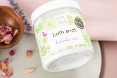 Lavender Rose Bath Soak shown in a lifestyle bathtub setting, highlighting product use and creating a relaxing, spa-like atmosphere