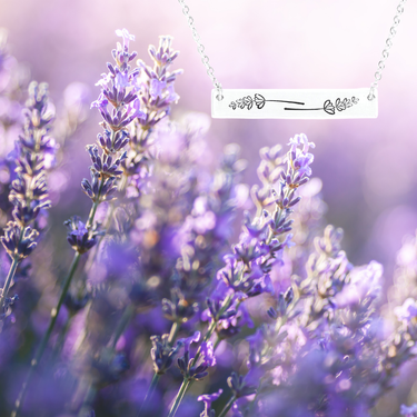 Lavender sprig bar necklace displayed on hang tag, showing design and packaging on a lavender background