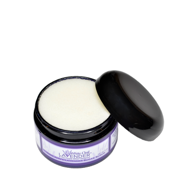 Open jar of Nana Juju Sugar Scrub container showing  creamy texture for exfoliating and nourishing skin